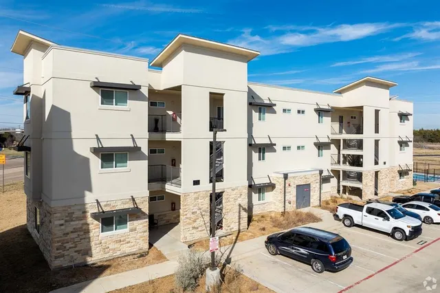 a view of a street with cars