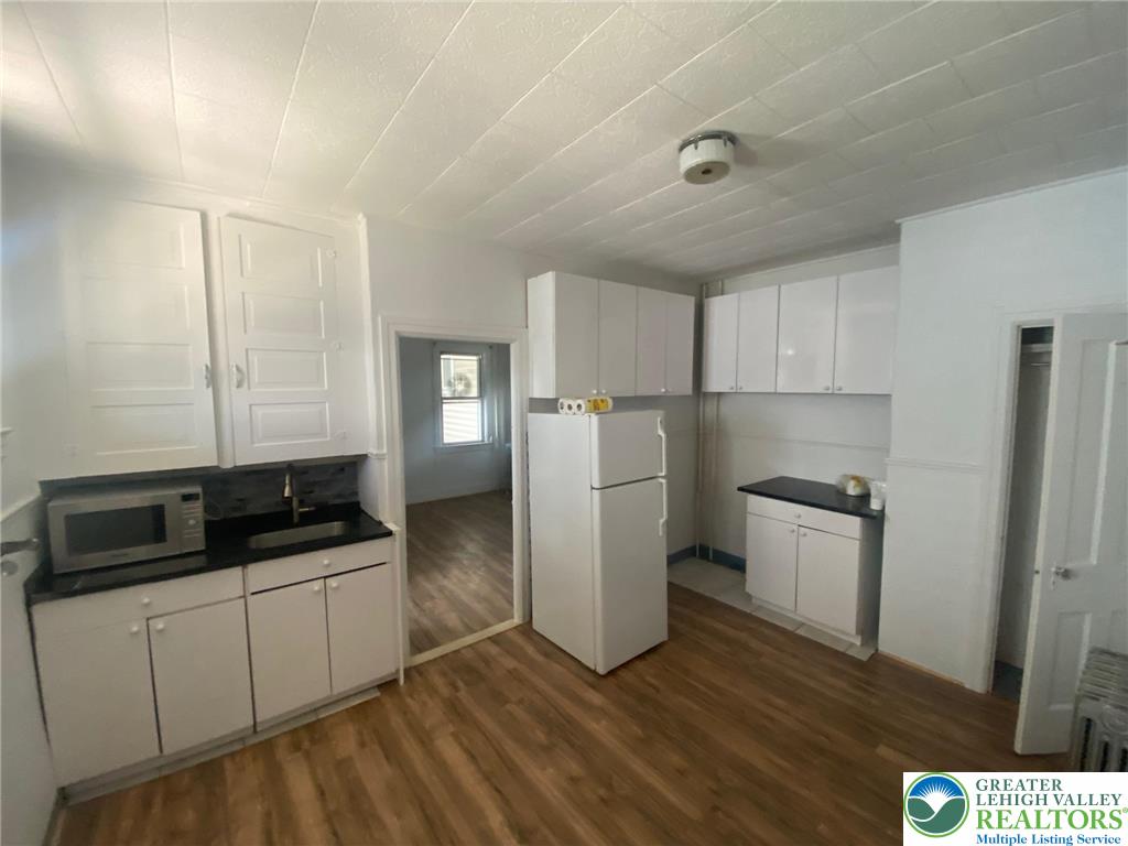 15 West High Street, Unit 1 Coaldale, PA 18218 - Photo 3 of 5 a kitchen with a refrigerator sink and stove