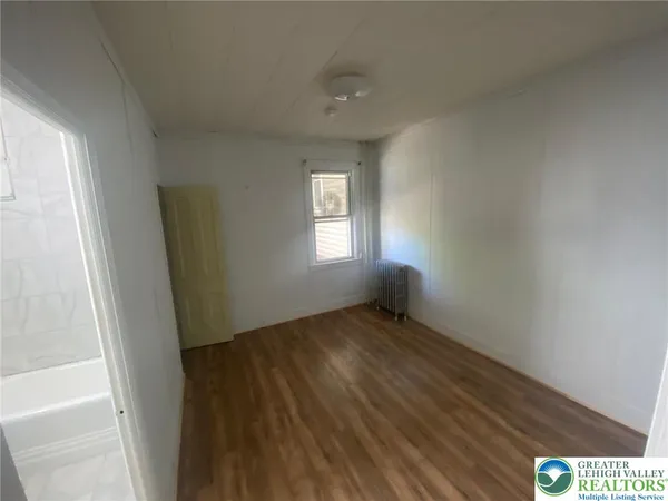 a view of an empty room and window