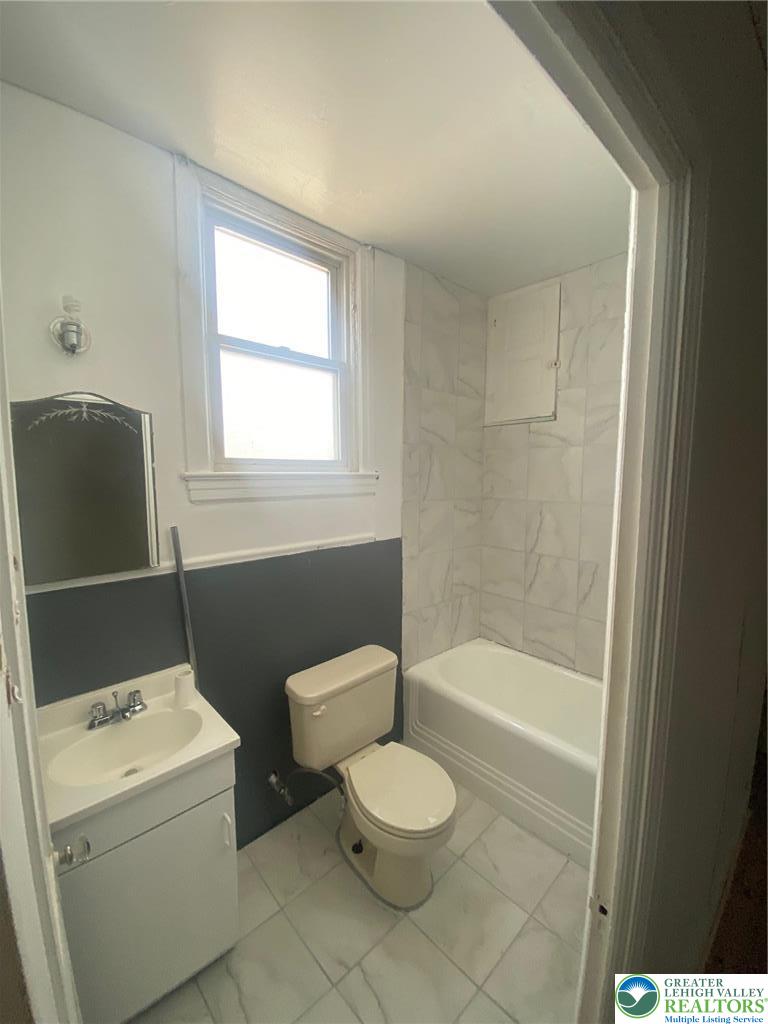 15 West High Street, Unit 1 Coaldale, PA 18218 - Photo 5 of 5 a bathroom with a toilet a sink and bathtub