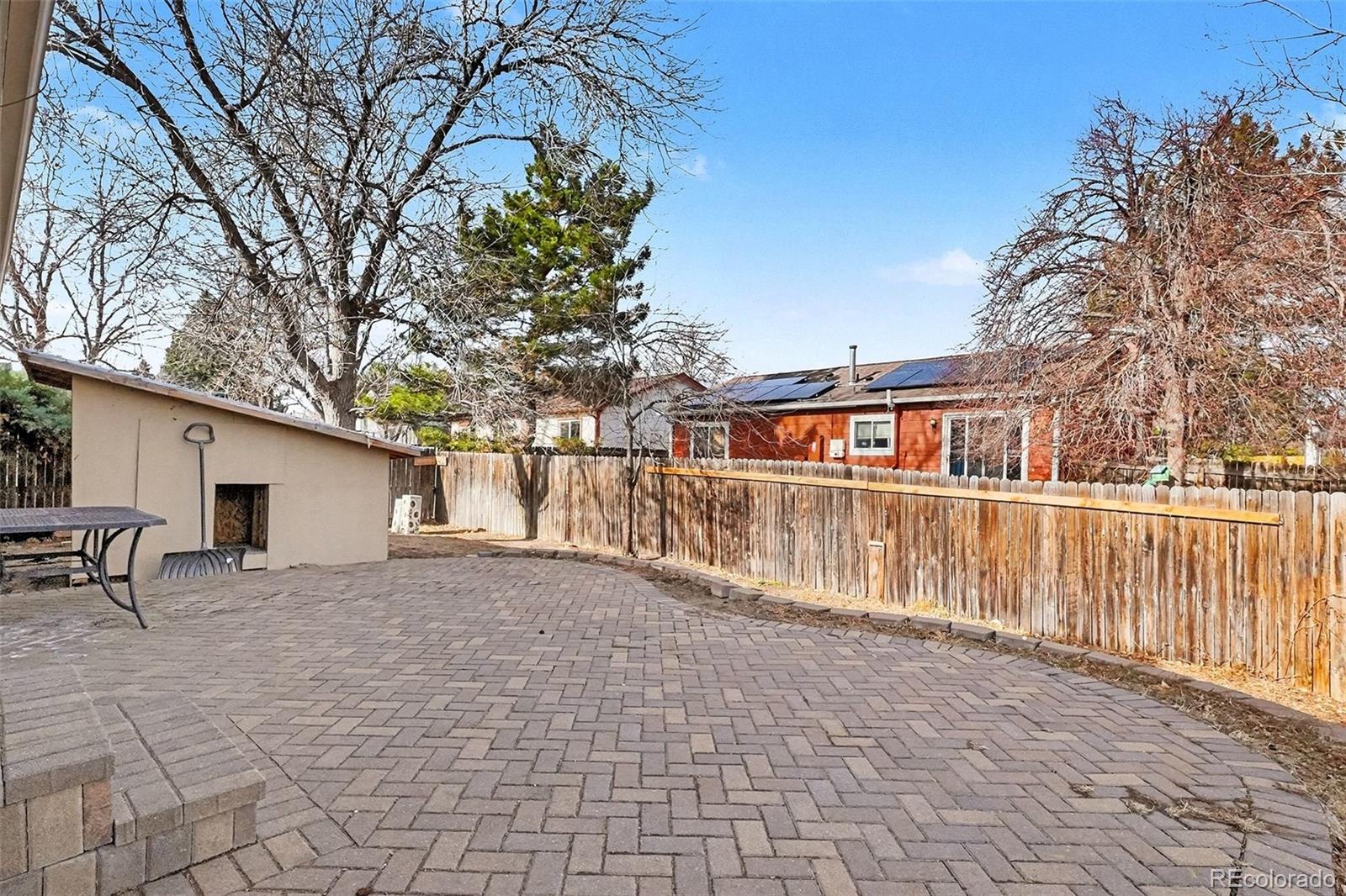 4105 South Laredo Way Aurora, CO 80013 - Photo 11 of 11 a view of house with a yard