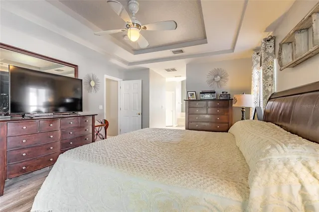 a bathroom with a tub shower and sink