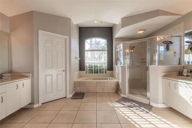 a bedroom with a bed and a television