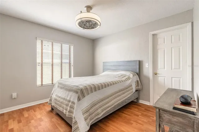 a bed room with a bed and chandelier