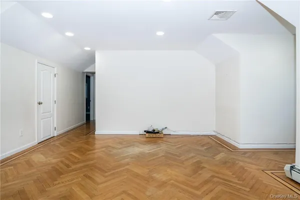 a view of a hallway with a bathroom