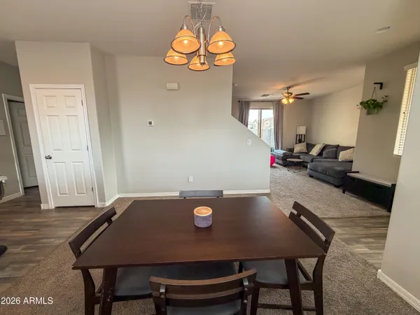 a kitchen with a sink stainless steel appliances cabinets and a counter top space