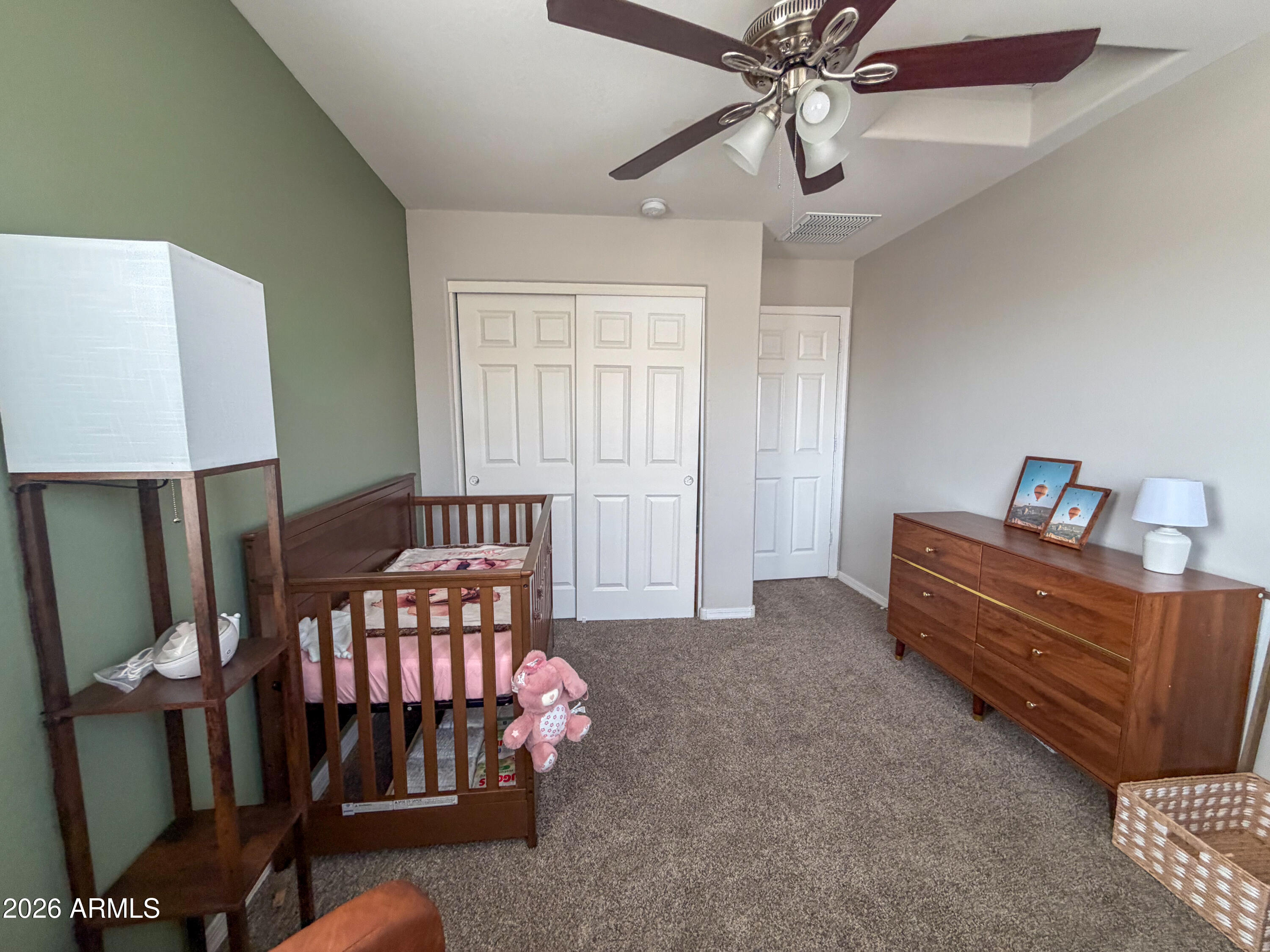 5480 Fulton Street Phoenix, AZ 85043 - Photo 22 of 63 a bedroom with furniture and a window