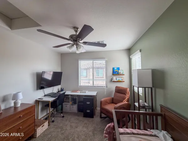 a bedroom with a bed and window