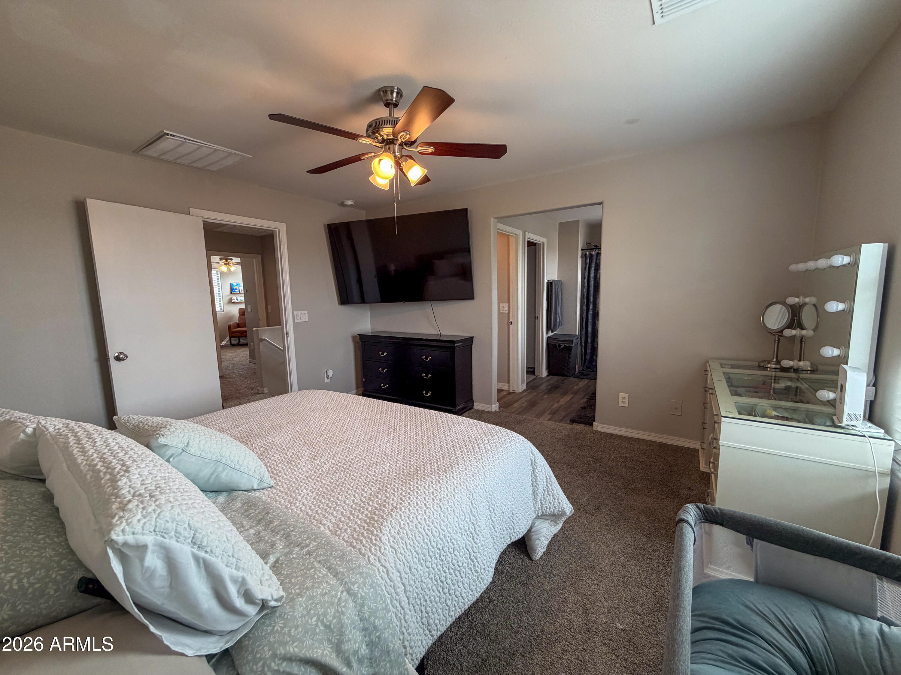 5480 Fulton Street Phoenix, AZ 85043 - Photo 35 of 63 a spacious bedroom with a bed and a television