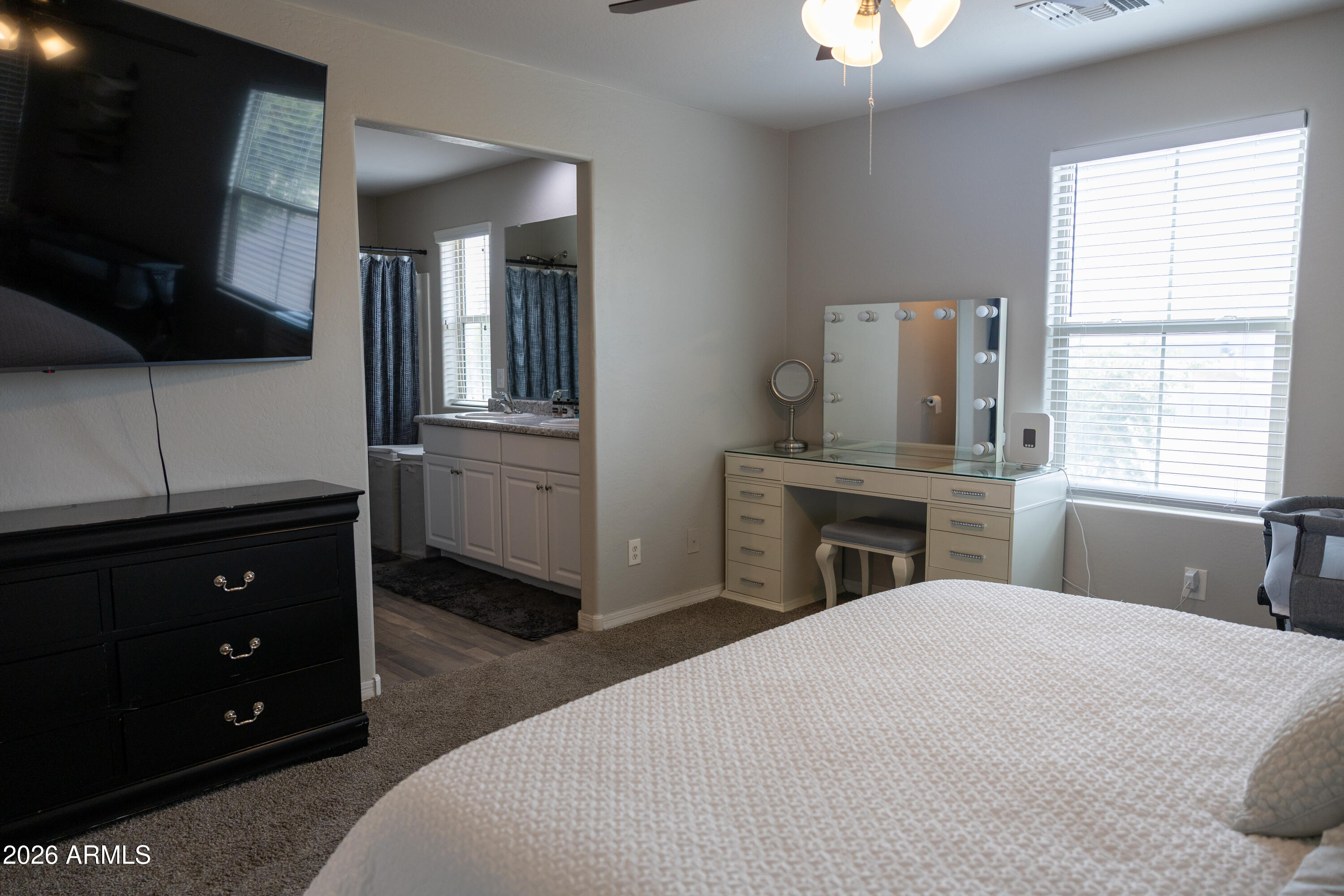5480 Fulton Street Phoenix, AZ 85043 - Photo 36 of 63 a bedroom with a bed and a flat screen tv