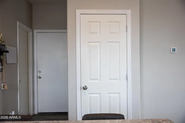a view of walk in closet with clothes