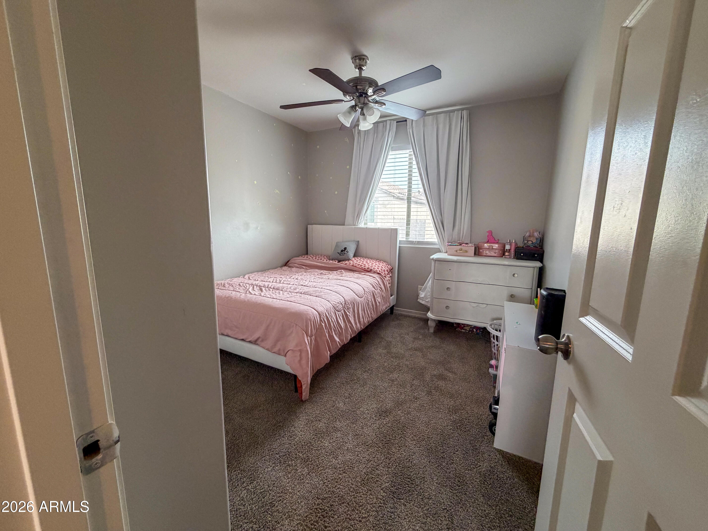 5480 Fulton Street Phoenix, AZ 85043 - Photo 43 of 63 a bedroom with a bed and a chandelier
