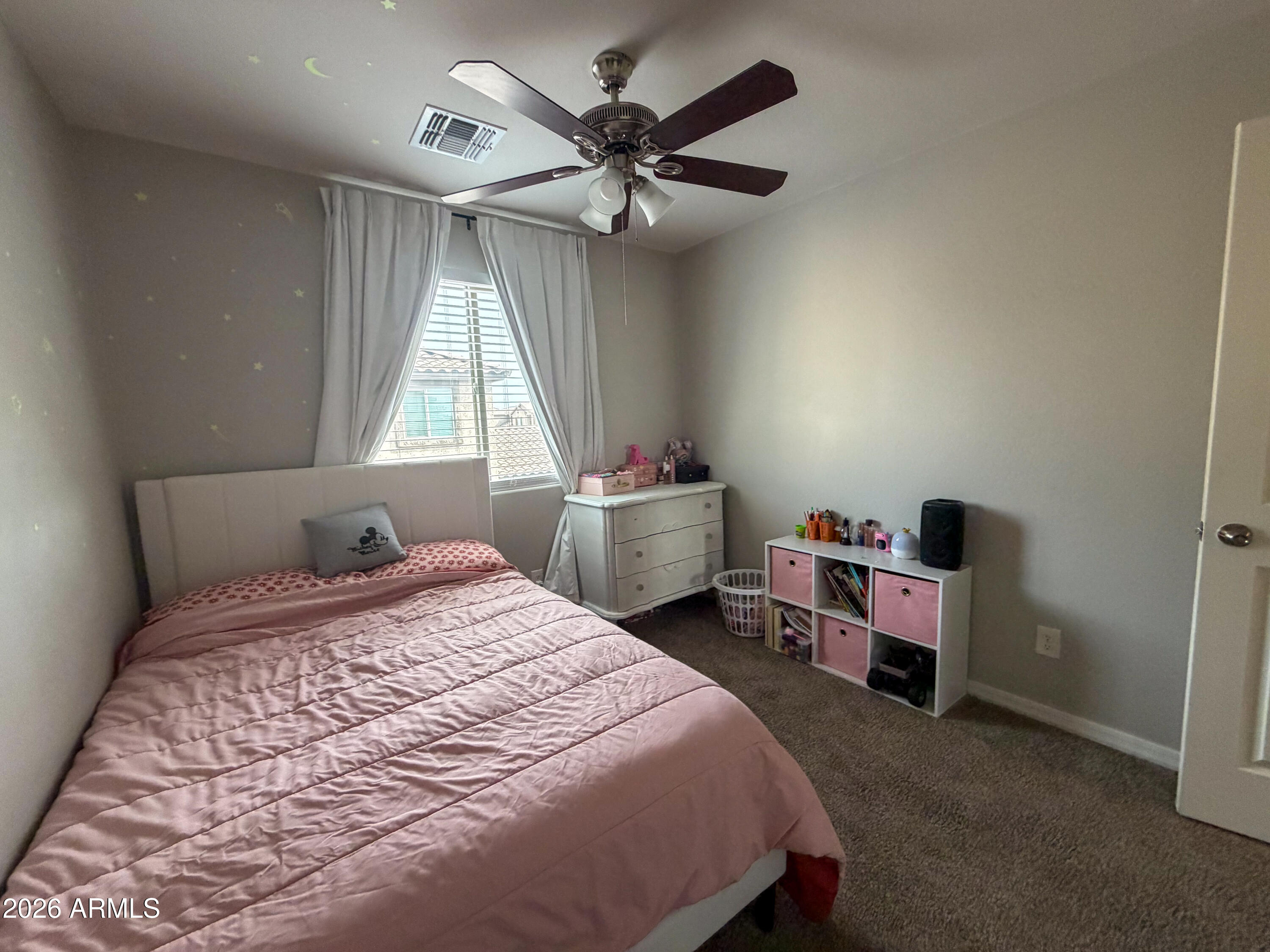 5480 Fulton Street Phoenix, AZ 85043 - Photo 44 of 63 a bedroom with a bed and a window