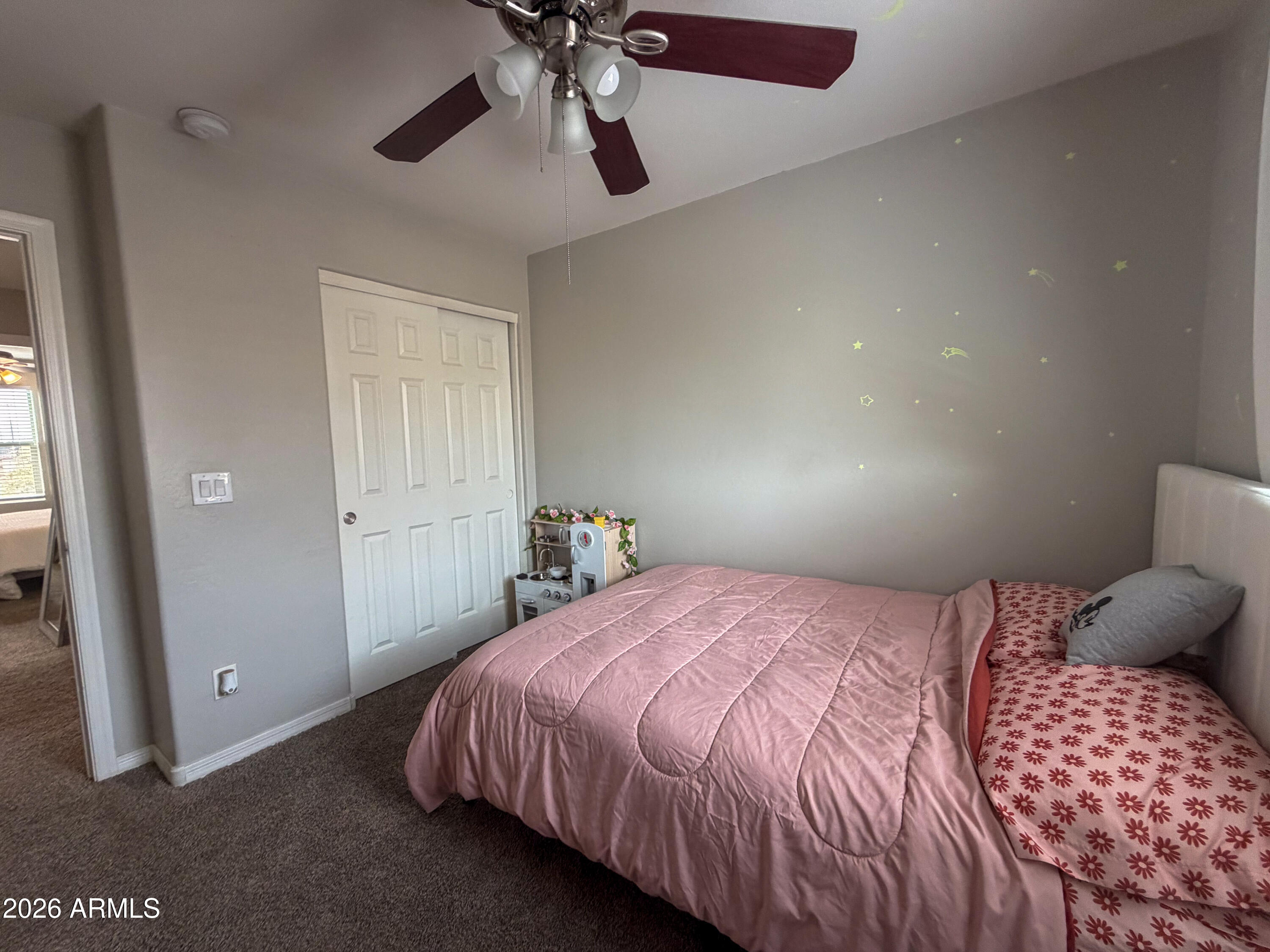 5480 Fulton Street Phoenix, AZ 85043 - Photo 45 of 63 a bedroom with a bed and a chandelier