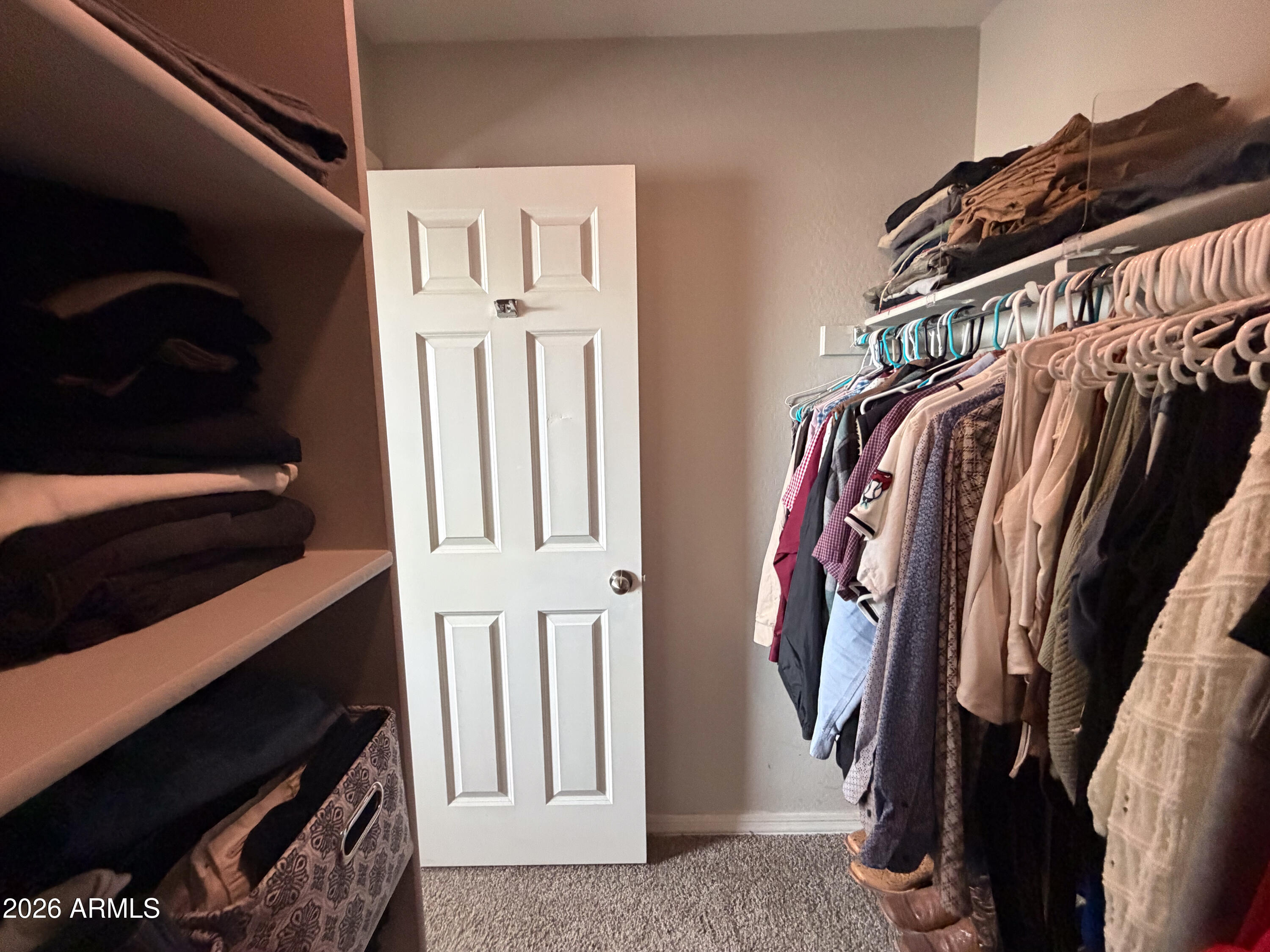 5480 Fulton Street Phoenix, AZ 85043 - Photo 47 of 63 a view of walk in closet with clothes and shoes