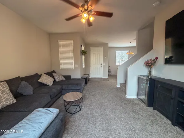 a living room with furniture and a window