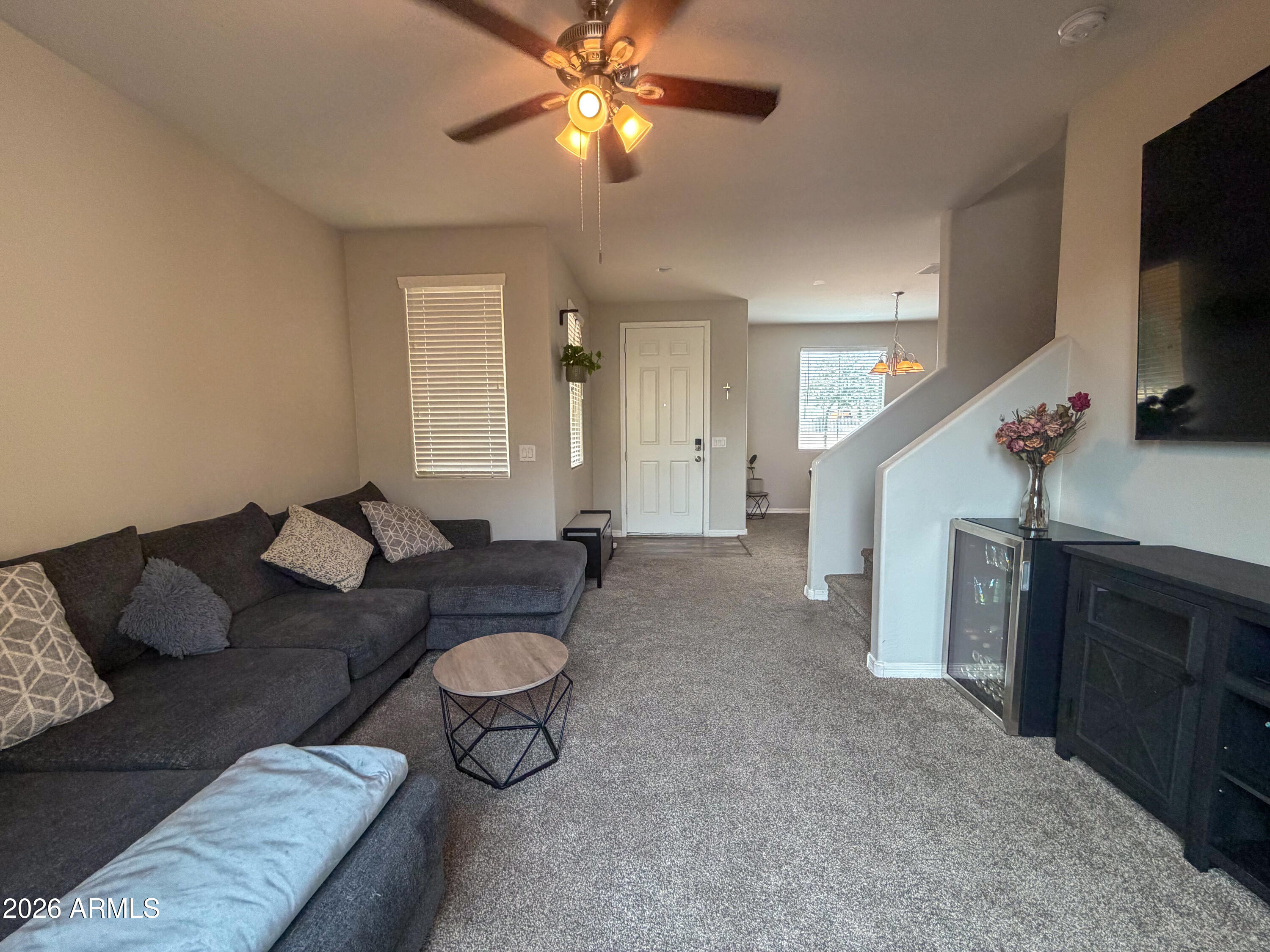 5480 Fulton Street Phoenix, AZ 85043 - Photo 5 of 63 a living room with furniture and a flat screen tv