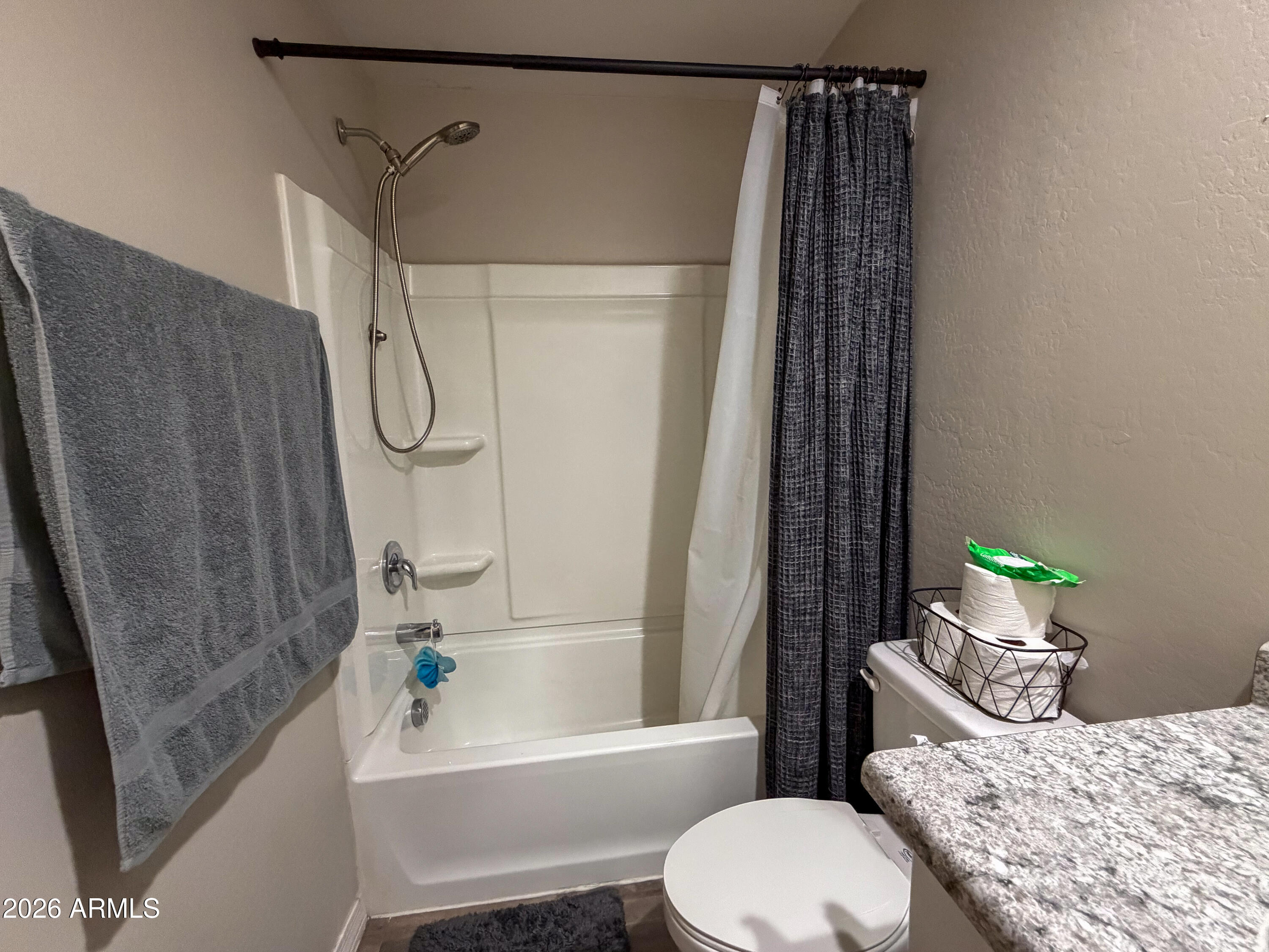 5480 Fulton Street Phoenix, AZ 85043 - Photo 54 of 63 a bathroom with a granite countertop bathtub shower sink vanity and toilet