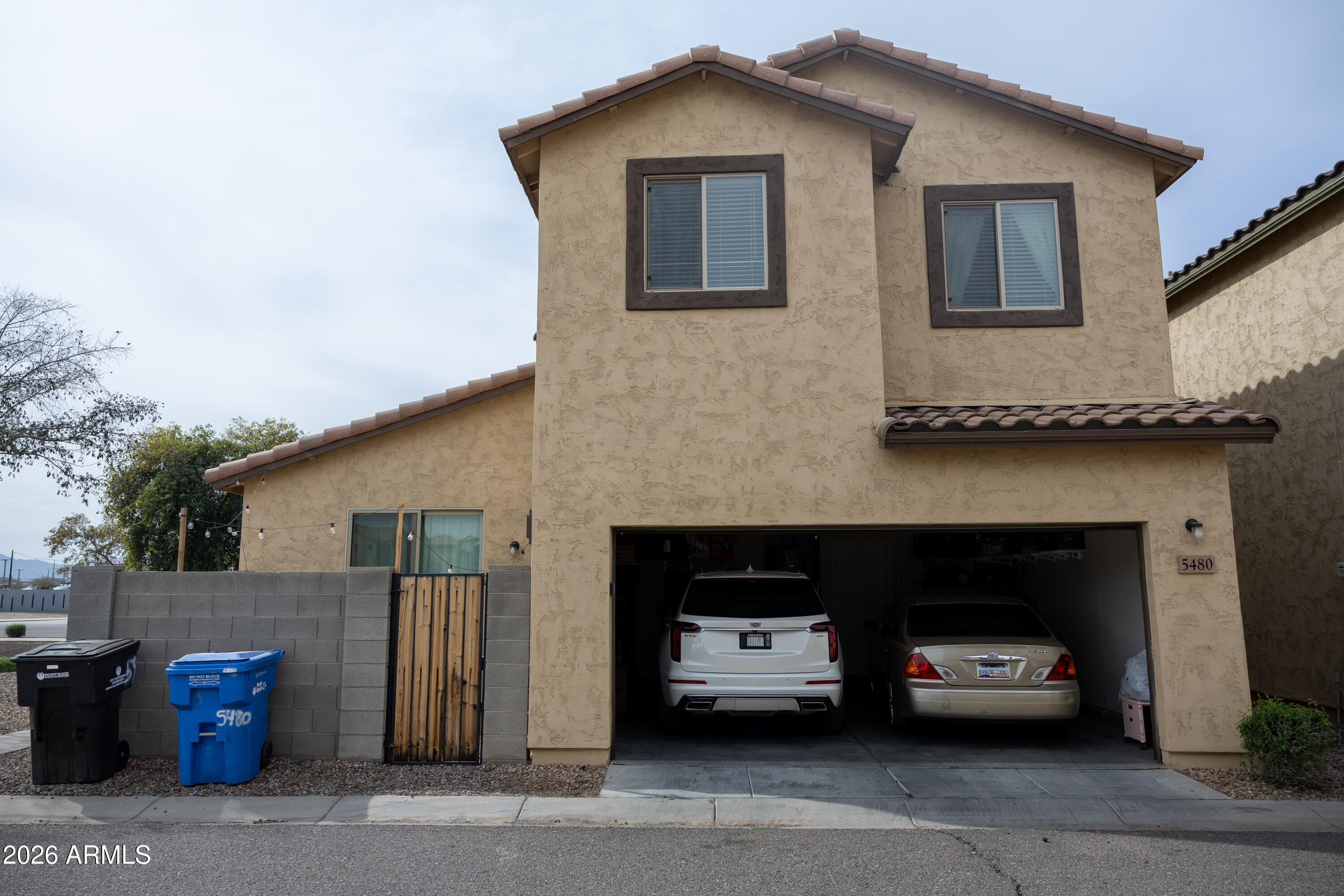 5480 Fulton Street Phoenix, AZ 85043 - Photo 59 of 63 a car parked in front of a house