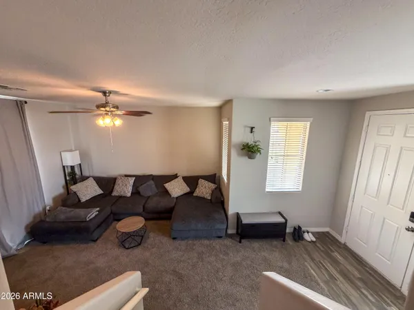 a living room with furniture and a large window