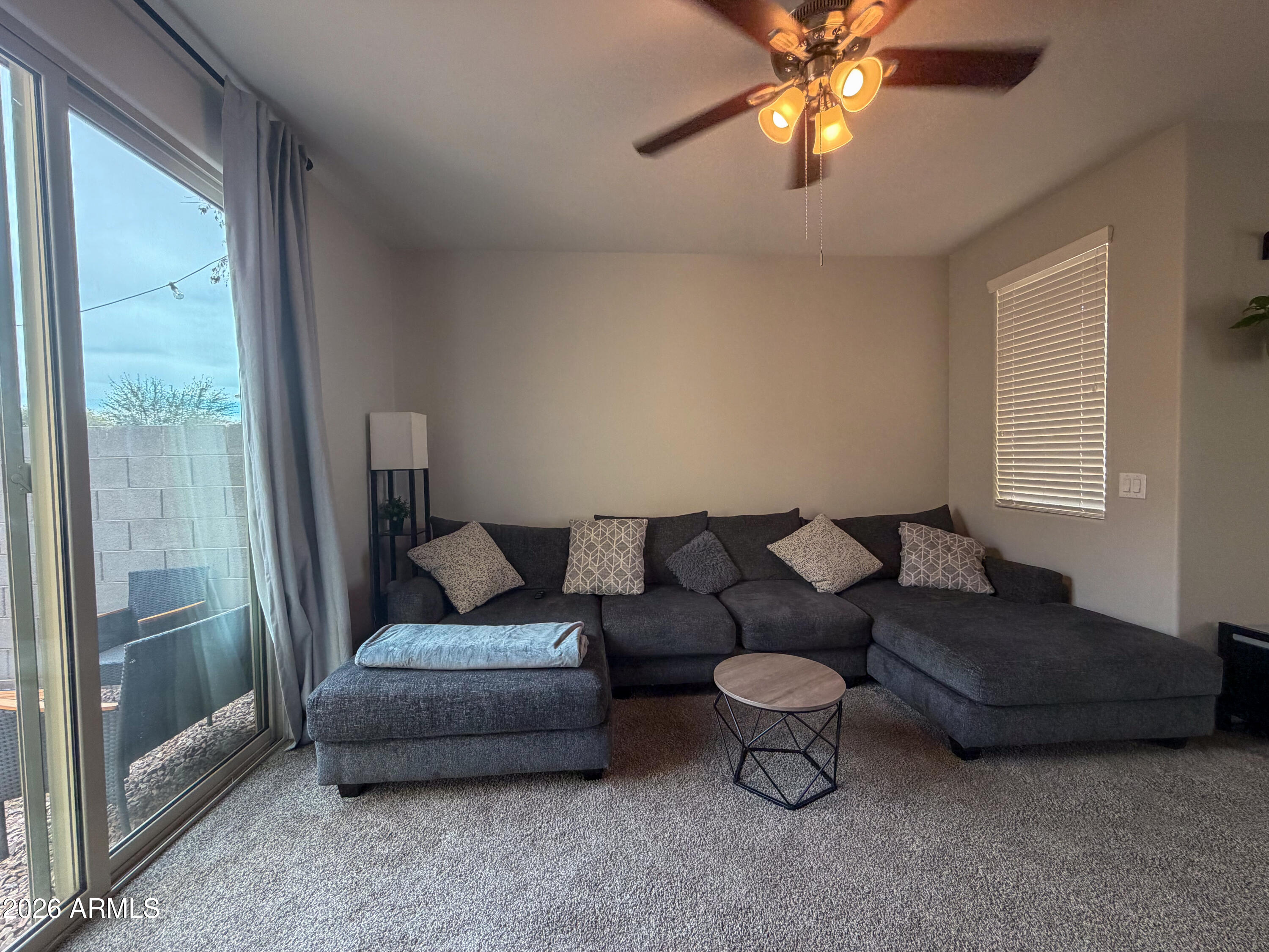 5480 Fulton Street Phoenix, AZ 85043 - Photo 8 of 63 a living room with furniture and a window