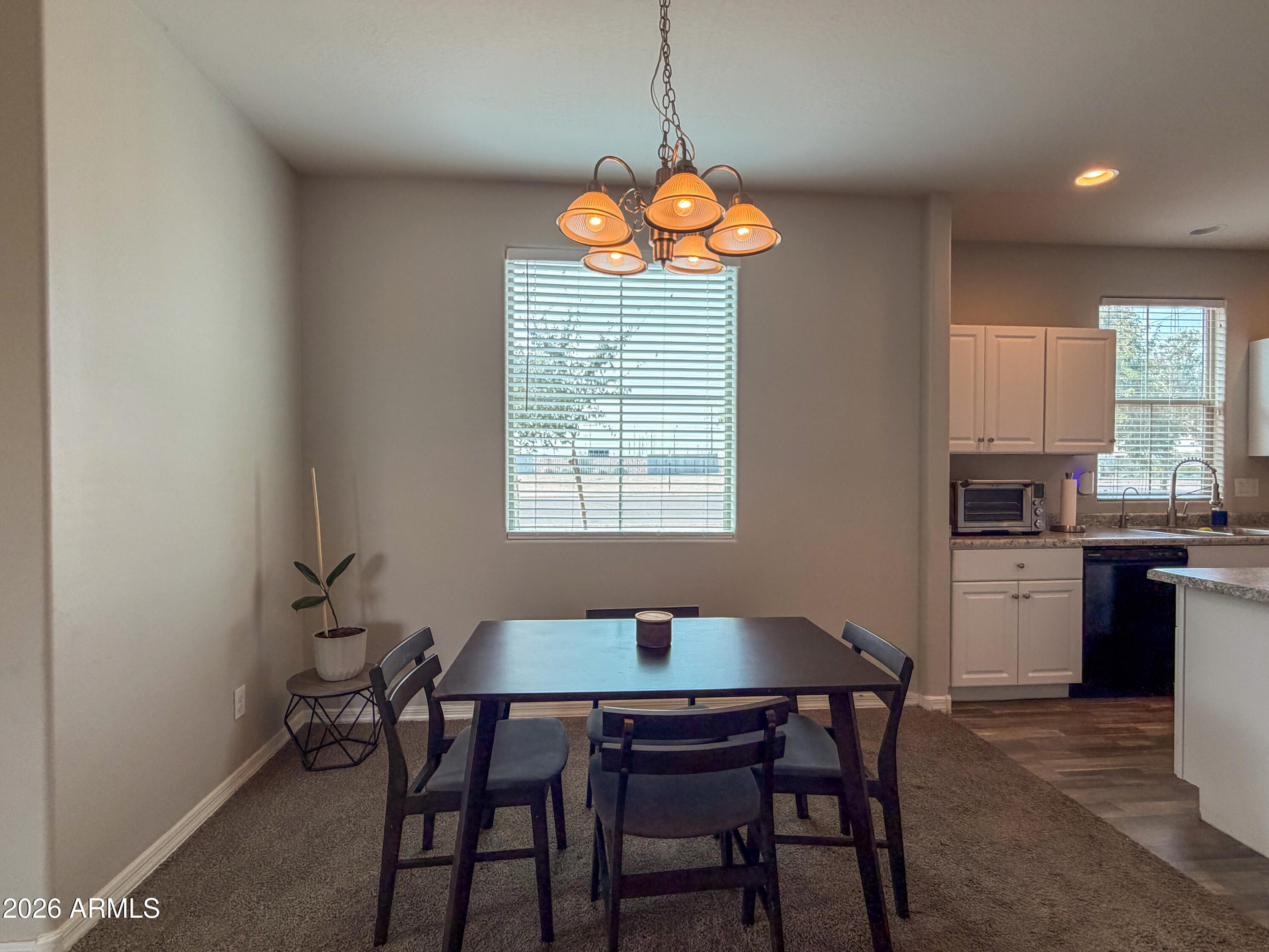 5480 Fulton Street Phoenix, AZ 85043 - Photo 10 of 63 a dining room filled chandelier and a window