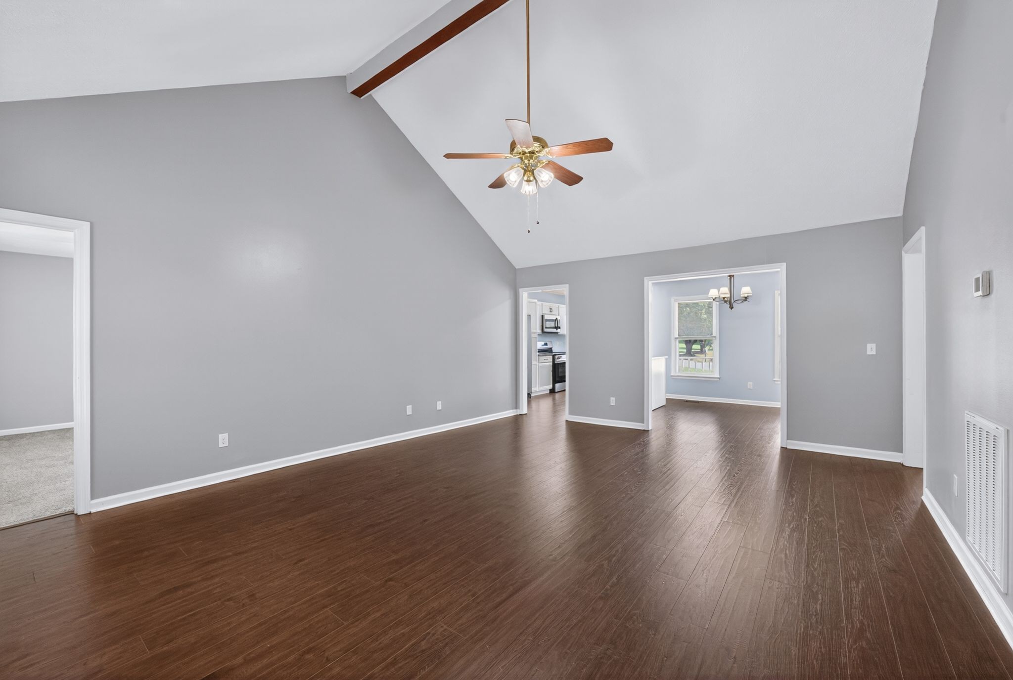 217 Timberlake Drive Springfield, TN 37172 - Photo 5 of 31 a view of an empty room with a window and wooden floor