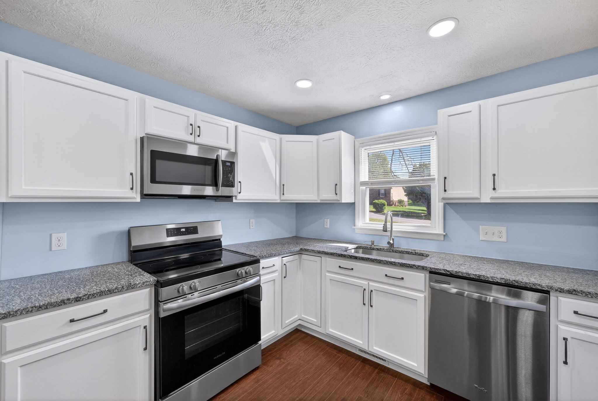 217 Timberlake Drive Springfield, TN 37172 - Photo 7 of 31 a kitchen with cabinets stainless steel appliances a sink and a counter space