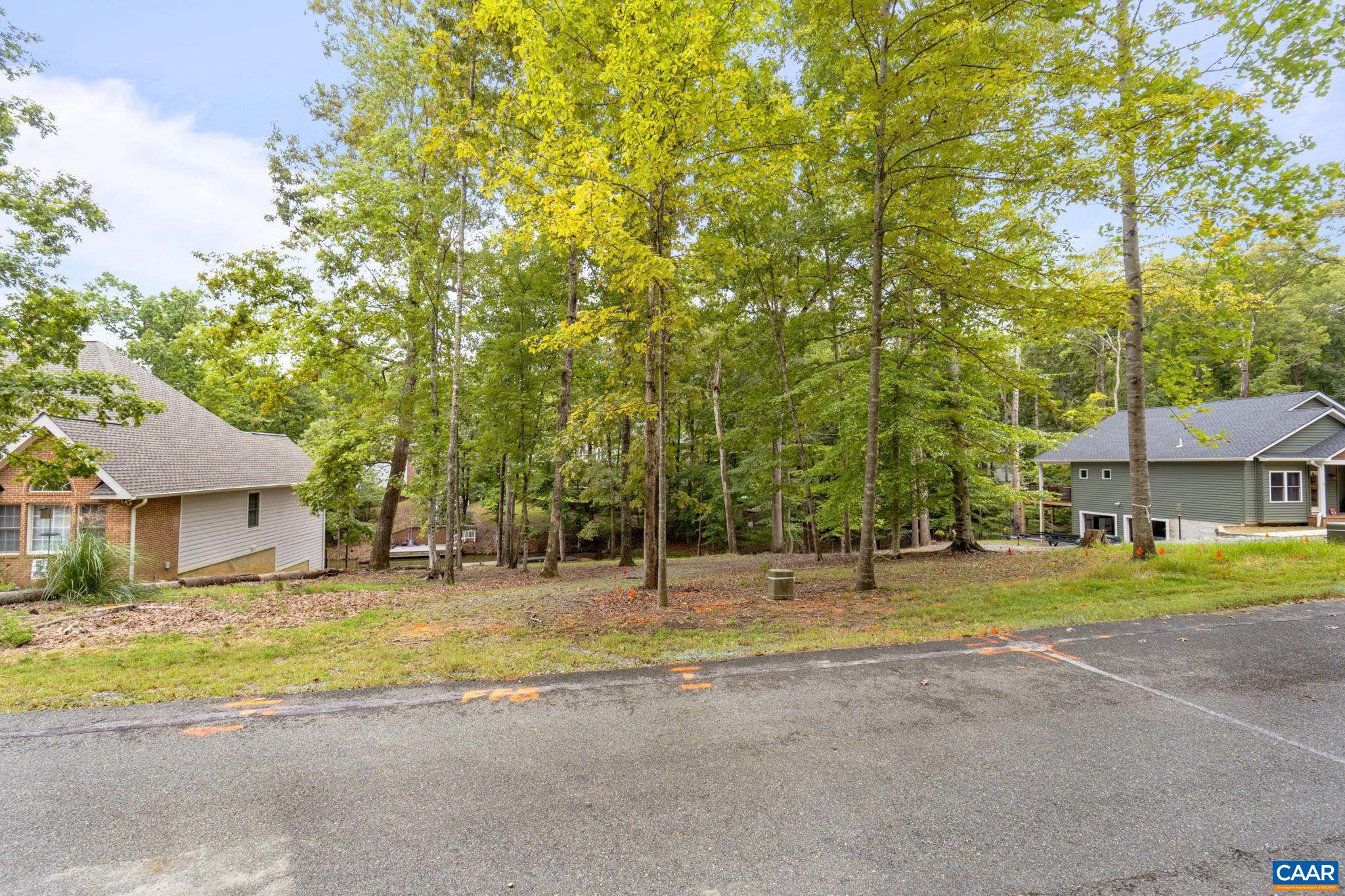 17 Amethyst Road Palmyra, VA 22963 - Photo 4 of 29 a view of a house with a big yard and large trees