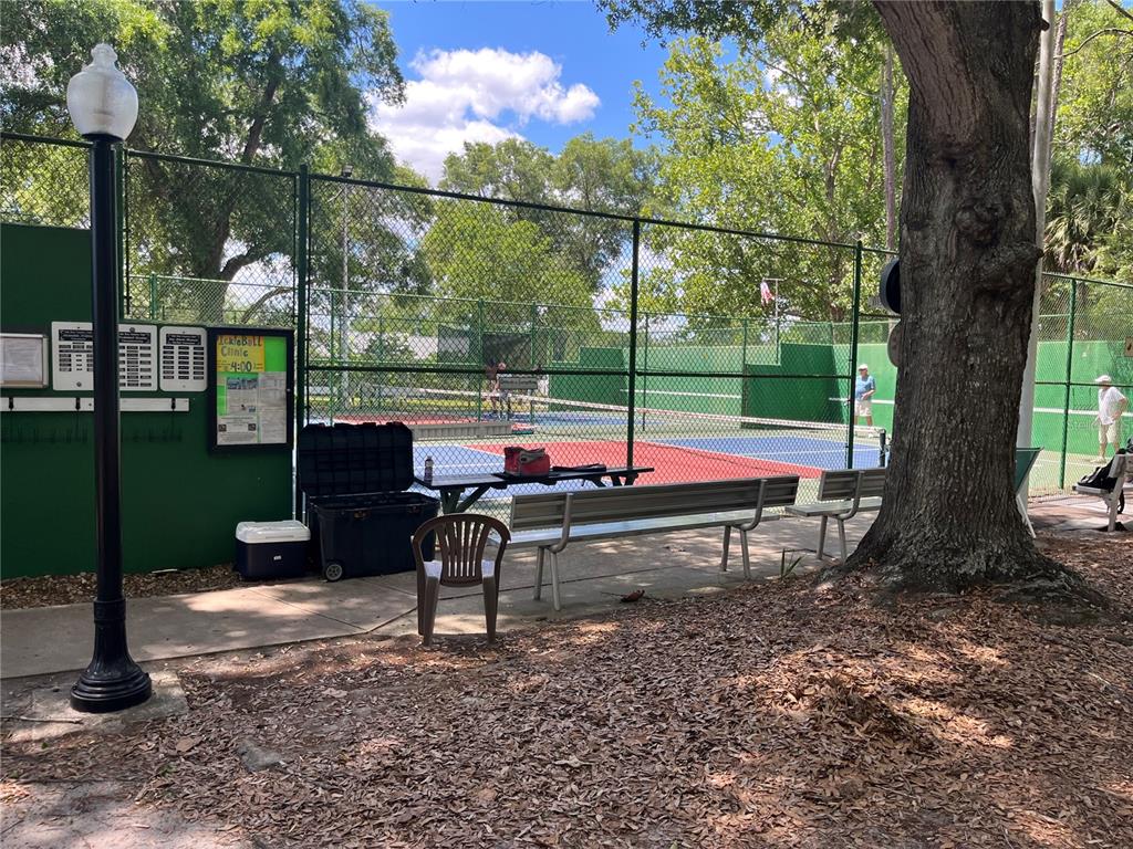 8744 Southwest 108th Ln Road Ocala, FL 34481 - Photo 24 of 28 a view of a bench in a backyard