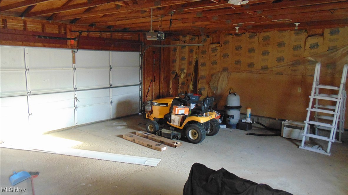 4970 Bryenton Road Litchfield, OH 44253 - Photo 26 of 33 Garage with a garage door opener