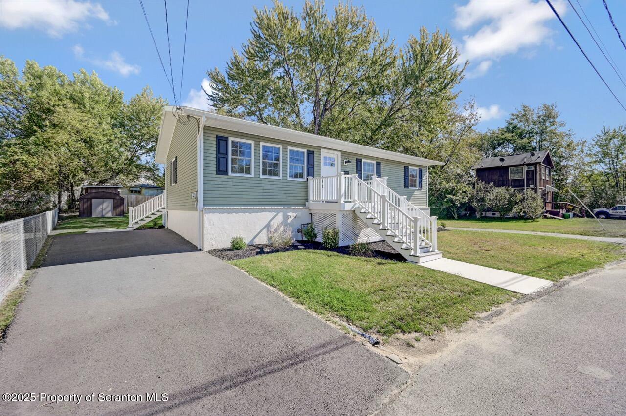 110 Morgan Street Jessup, PA 18434 - Photo 2 of 45 a front view of a house with a yard