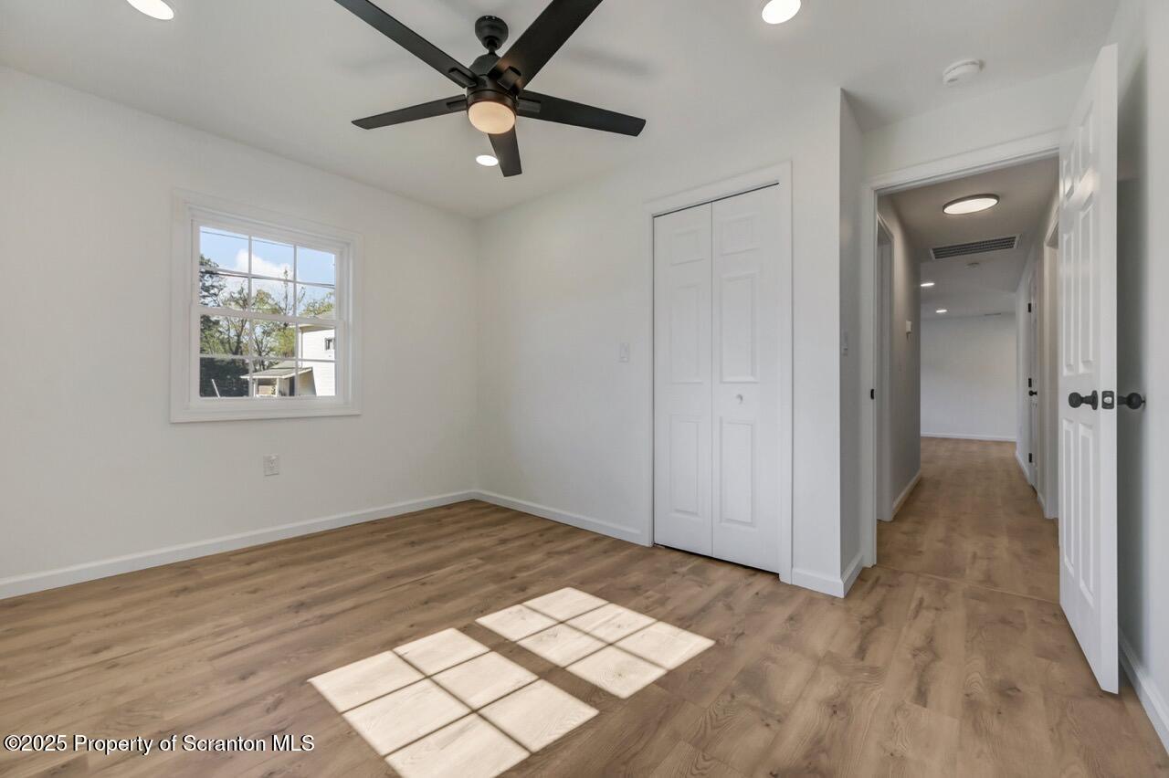 110 Morgan Street Jessup, PA 18434 - Photo 22 of 45 wooden floor in an empty room with a window