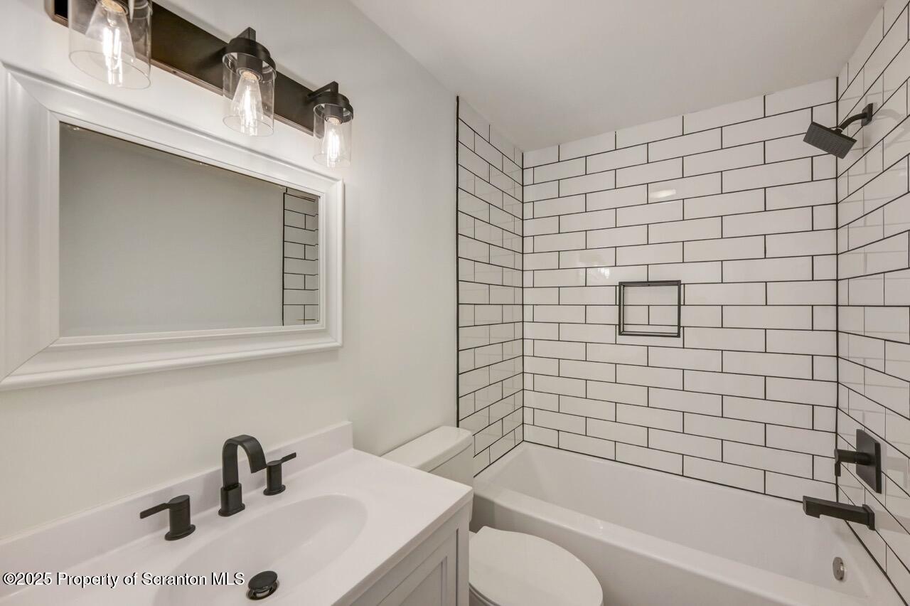 110 Morgan Street Jessup, PA 18434 - Photo 24 of 45 a bathroom with a sink and a bathtub