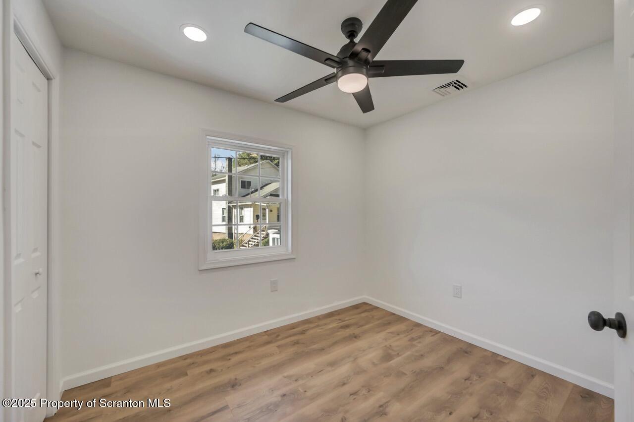 110 Morgan Street Jessup, PA 18434 - Photo 26 of 45 an empty room with a window and a fan