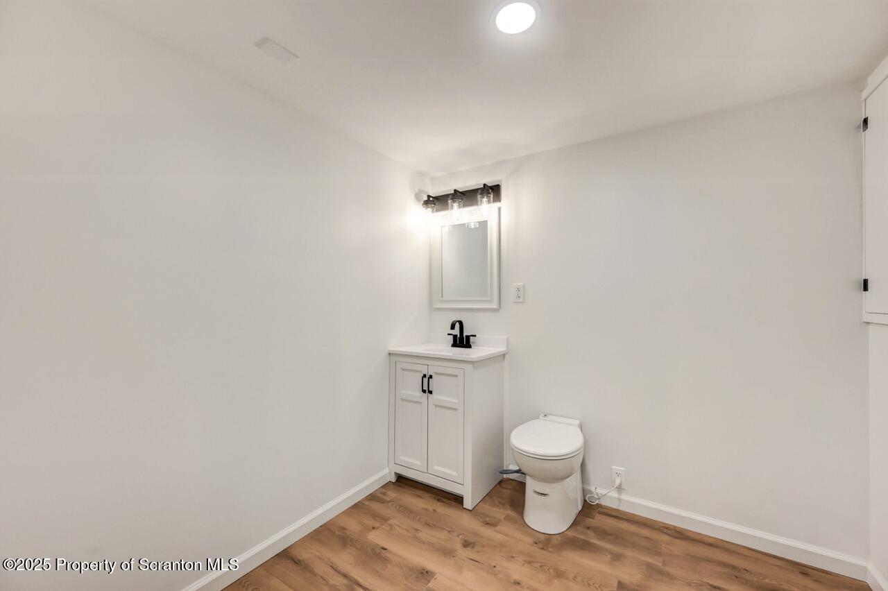 110 Morgan Street Jessup, PA 18434 - Photo 38 of 45 a bathroom with a toilet a sink and mirror