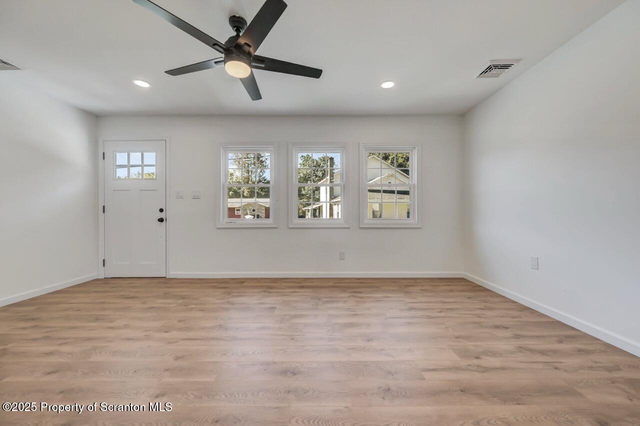 110 Morgan Street Jessup, PA 18434 - Photo 7 of 45 a view of an empty room with a window