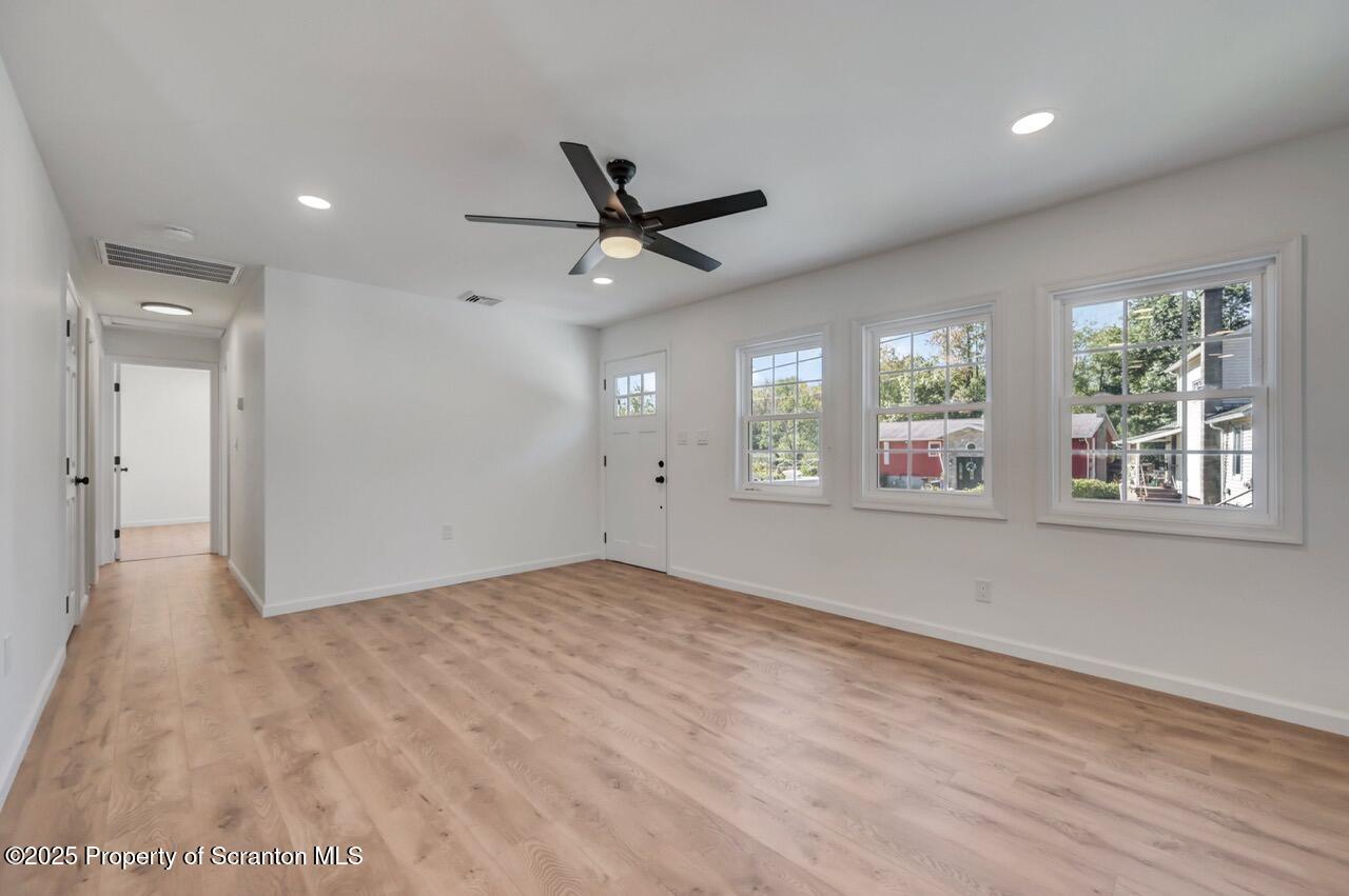 110 Morgan Street Jessup, PA 18434 - Photo 8 of 45 a view of an empty room with a window