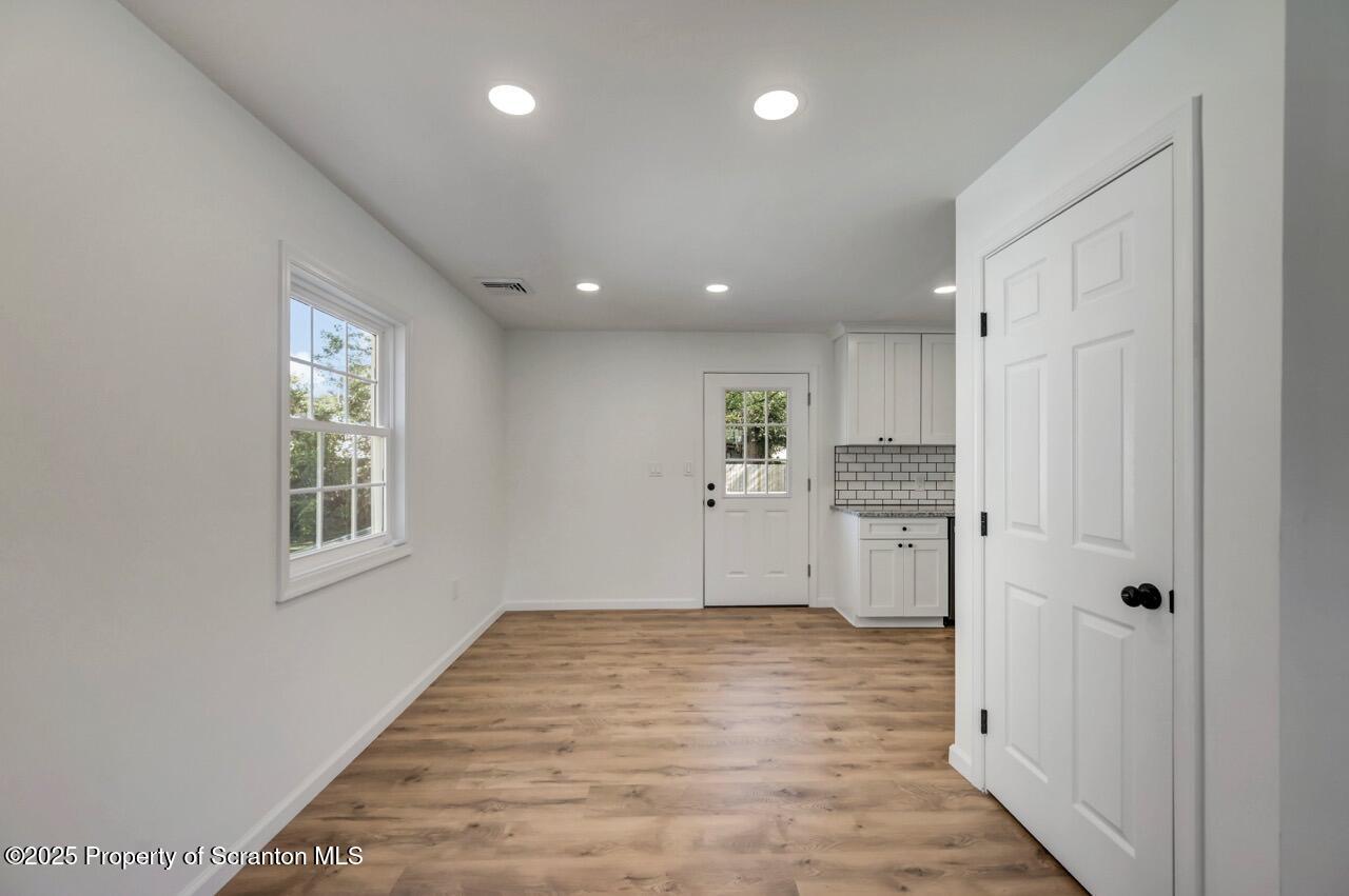 110 Morgan Street Jessup, PA 18434 - Photo 10 of 45 a view of an empty room with wooden floor and a window