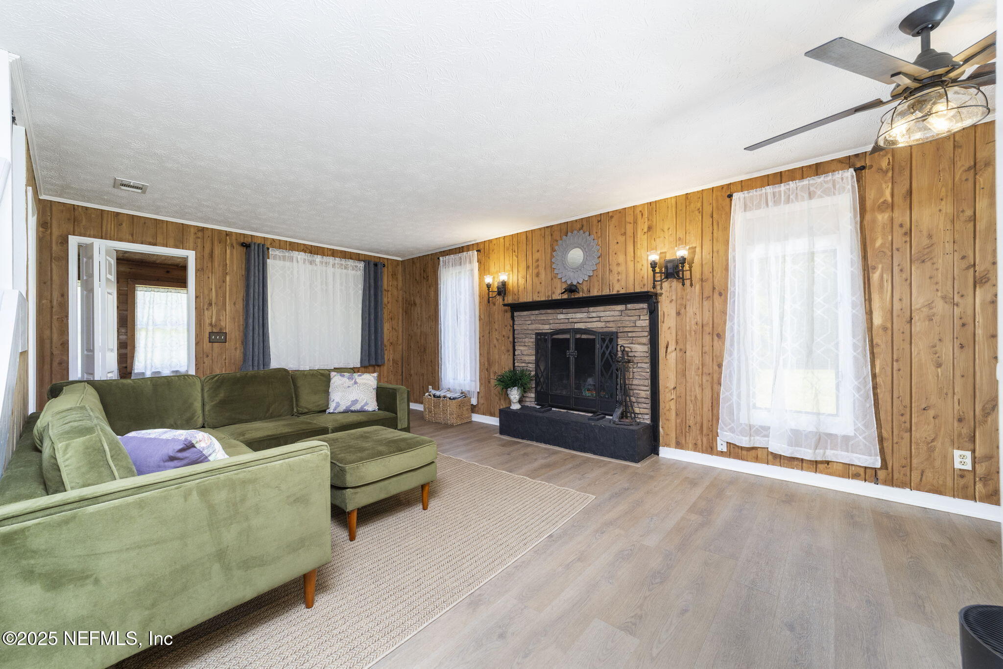 6183 George Hodges Road Macclenny, FL 32063 - Photo 18 of 97 a living room with furniture and a fireplace