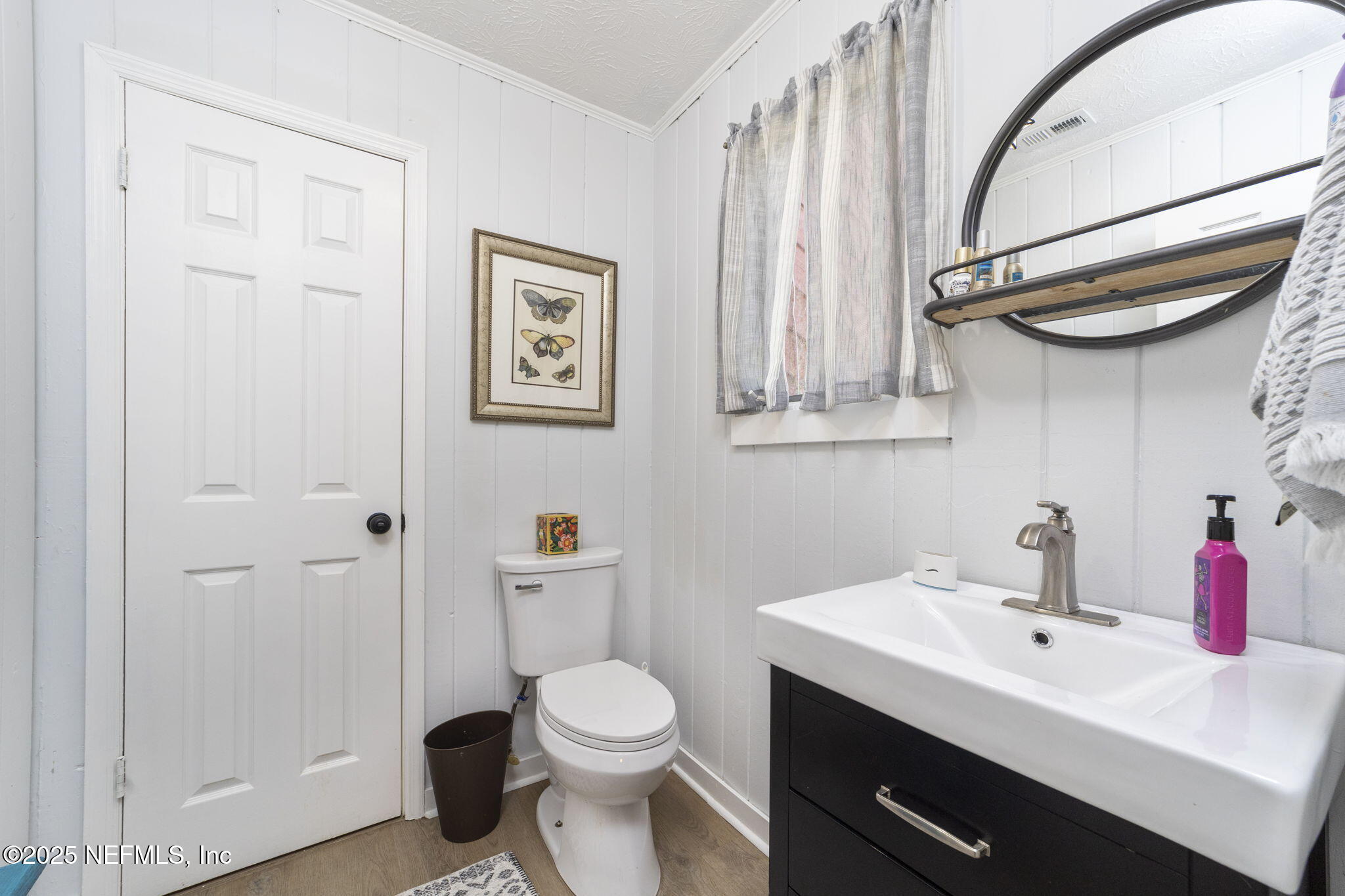 6183 George Hodges Road Macclenny, FL 32063 - Photo 25 of 97 a bathroom with a sink a toilet and a mirror