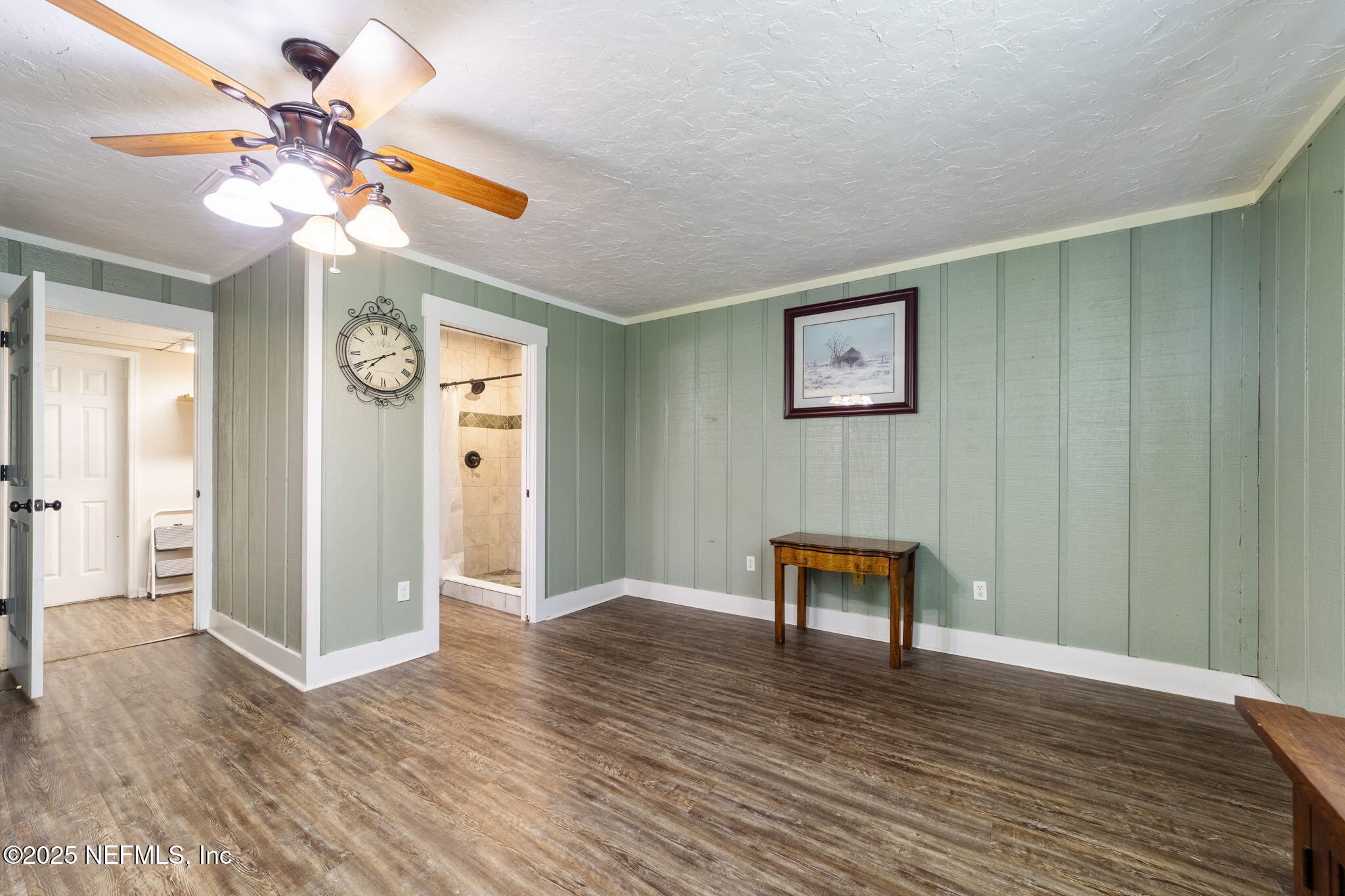 6183 George Hodges Road Macclenny, FL 32063 - Photo 33 of 97 a view of a livingroom with wooden floor and a ceiling fan
