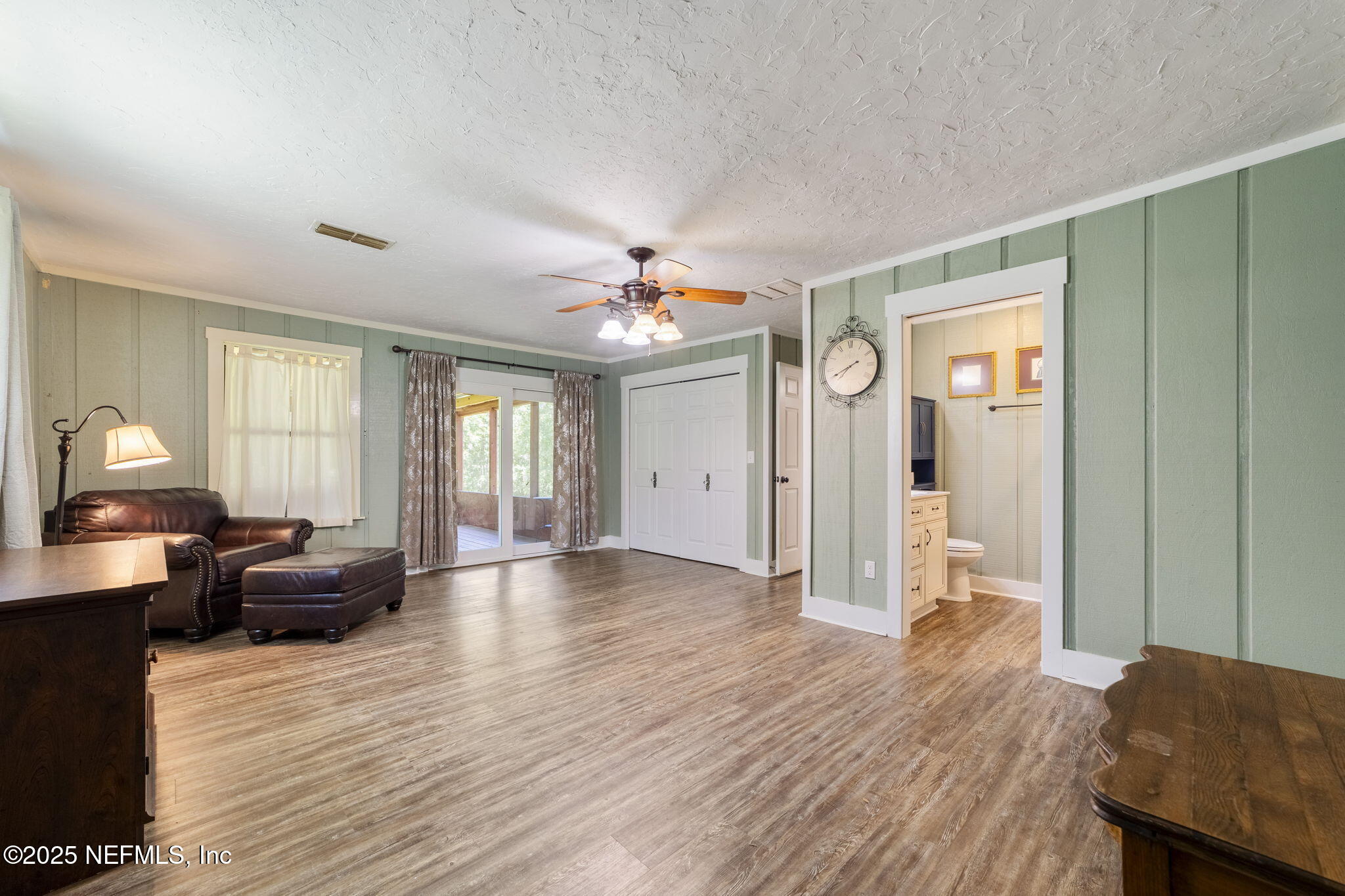 6183 George Hodges Road Macclenny, FL 32063 - Photo 36 of 97 a view of an empty room with wooden floor and a window