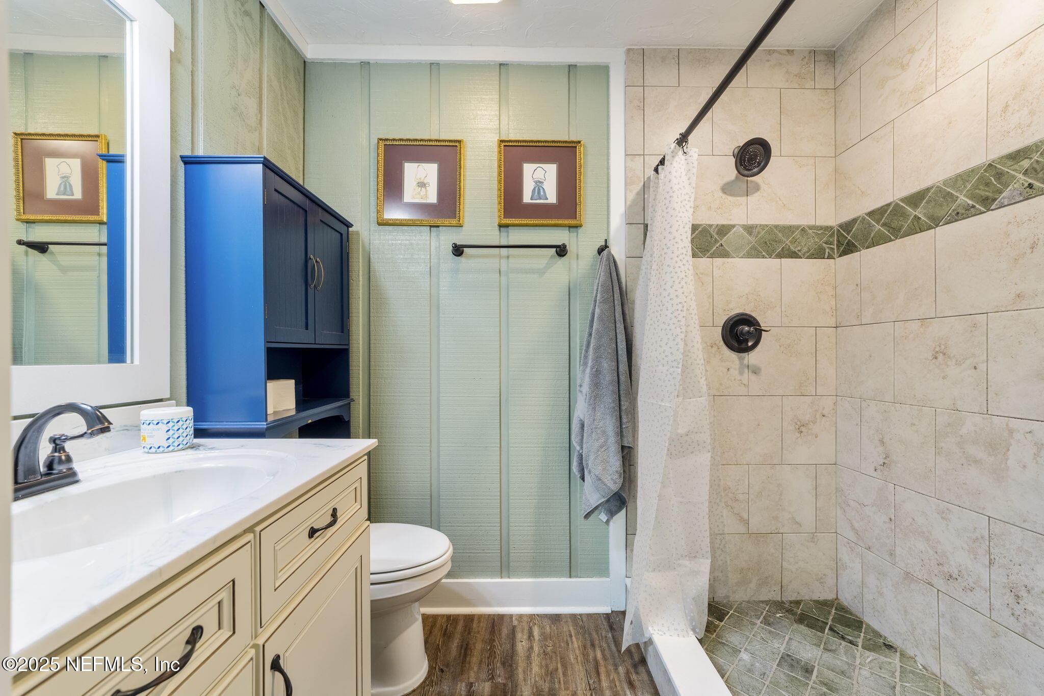 6183 George Hodges Road Macclenny, FL 32063 - Photo 37 of 97 a bathroom with a sink a toilet a mirror and shower