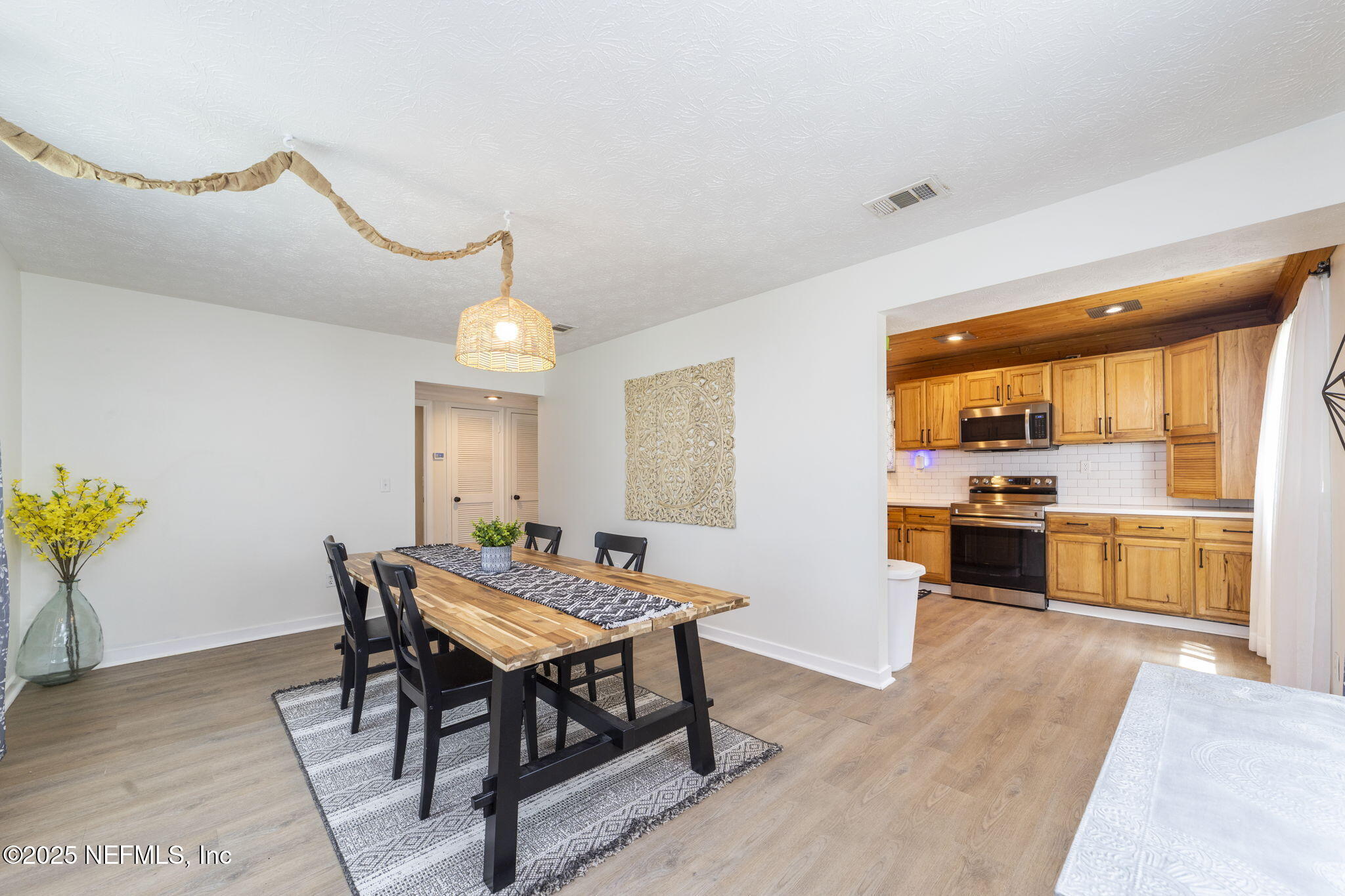 6183 George Hodges Road Macclenny, FL 32063 - Photo 83 of 97 a view of a dining room with furniture window and wooden floor