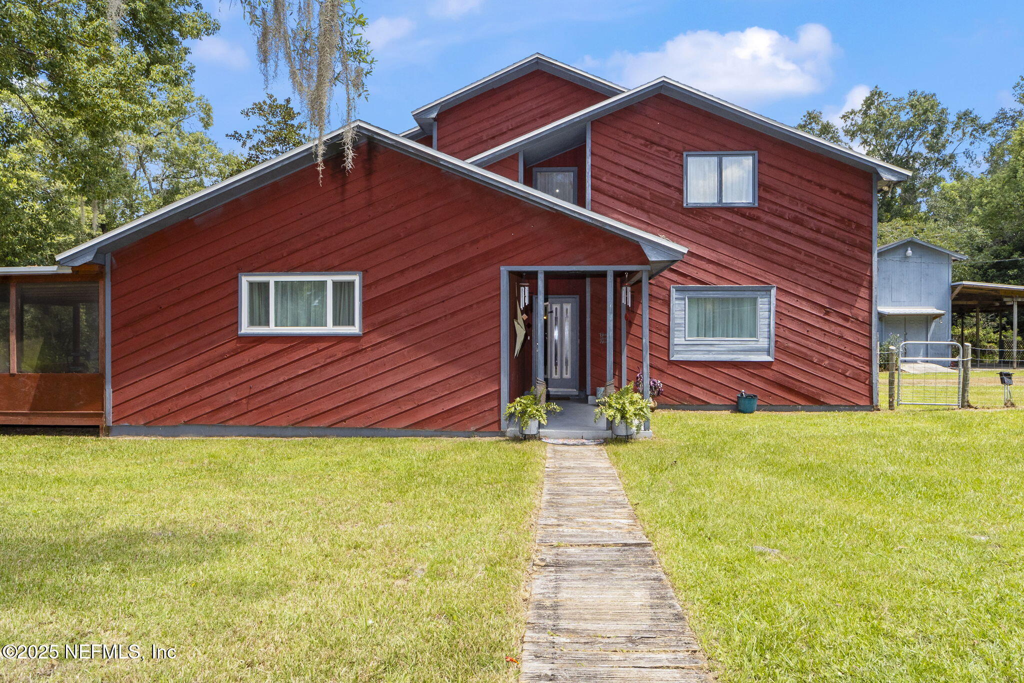 6183 George Hodges Road Macclenny, FL 32063 - Photo 9 of 97 a front view of a house with yard