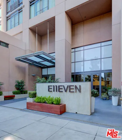 a front view of a building with potted plants