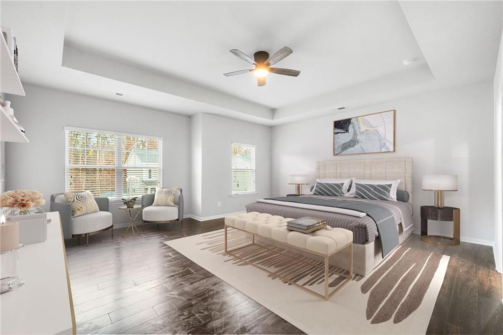 200 Cherokee Reserve Circle Canton, GA 30115 - Photo 25 of 50 a spacious bedroom with a bed and couch