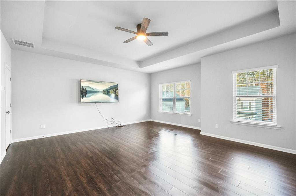 200 Cherokee Reserve Circle Canton, GA 30115 - Photo 27 of 50 a view of an empty room with wooden floor and a window