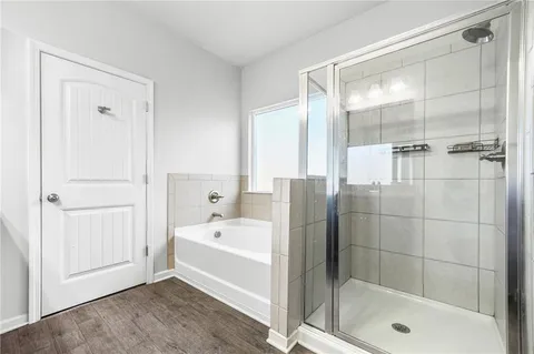 a bathroom with a bathtub and a shower